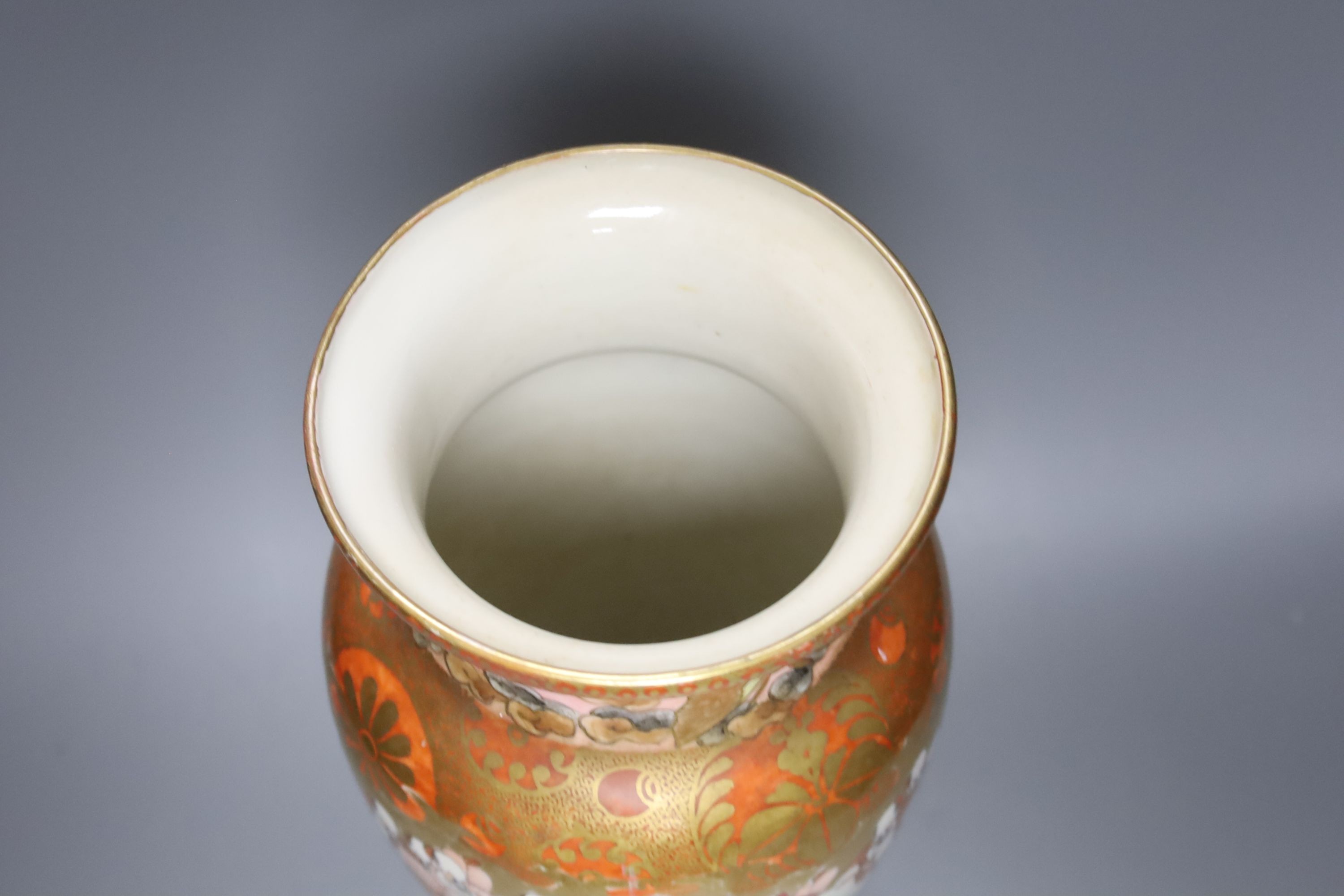 A tall Japanese Kutani porcelain vase, decorated with Rakan, 30cm, wood stand